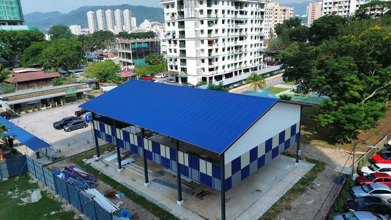 Blue metal deck hall roofing project by One Roof Solutions
