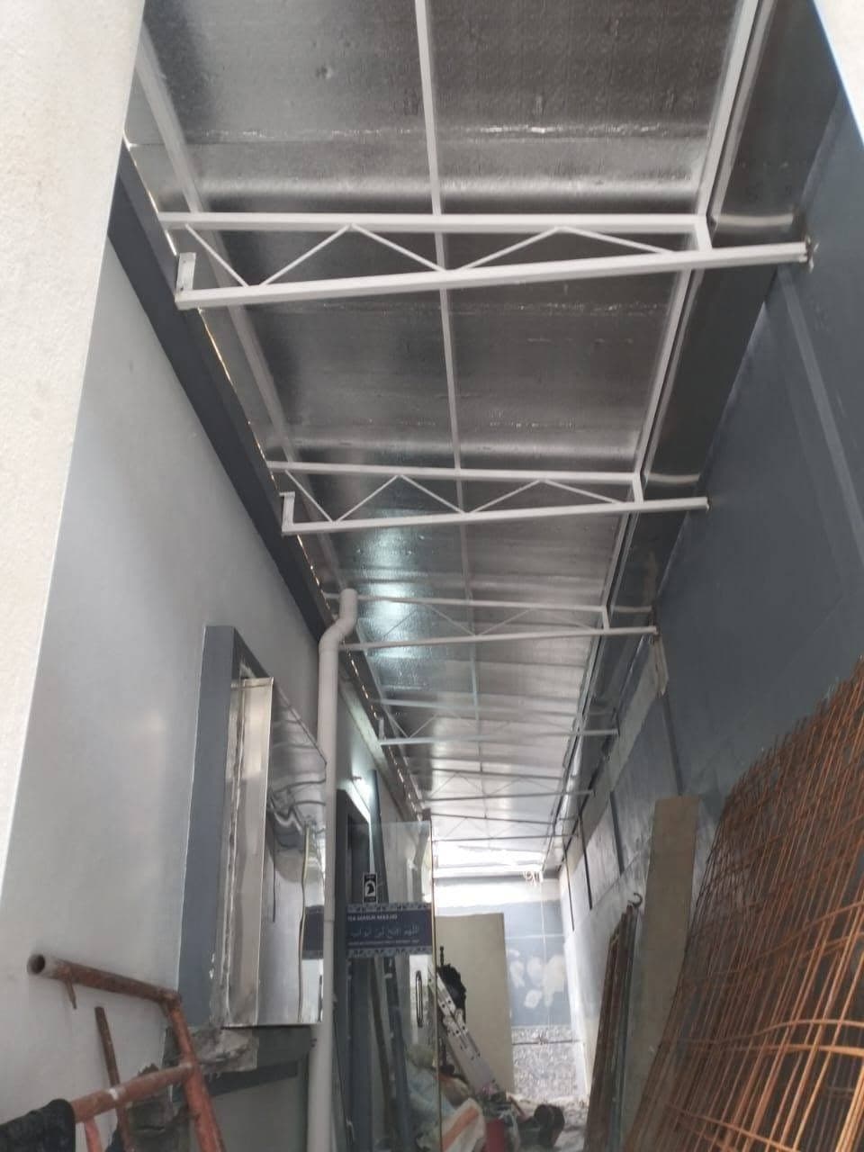 Covered walkway steel support project by One Roof Solutions